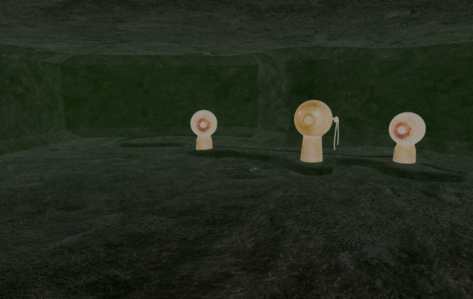 Imagem. Descrição da imagem: Uma cena de um ambiente digital escuro e cavernoso. Três objetos escultóricos em formato de olhos ou globos oculares sobre pedestais curtos estão dispostos pelo espaço. Eles são de cor bege clara com íris avermelhadas. O objeto central possui um cordão ou fiação saindo de sua lateral. O chão e as paredes têm uma textura áspera e escura. Fim da descrição da imagem.